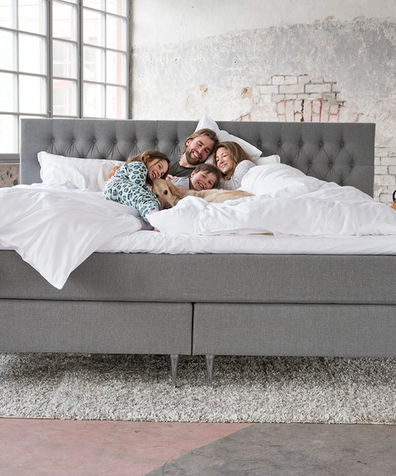 A family enjoying the comfort of an Elite bed